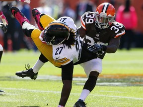 Pittsburgh Steelers running back LeGarrette Blount (27) carries the ball as Cleveland Browns safety Tashaun Gipson (39) defends during NFL play at FirstEnergy Stadium. (Ron Schwane/USA TODAY Sports)