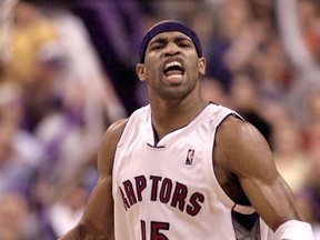 Toronto Raptors' Vince Carter reacts after scoring one of his eight three-pointers against the Philadelphia 76ers during Game 3 of their NBA Eastern Conference semifinal in Toronto May 11, 2001. Carter set an NBA record with his eight three-point shots in the first half. (Toronto Sun files)