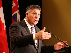 Ontario Finance Minister Charles Sousa speaks with Scotiabank and partners at the Sheraton Centre in downtown Toronto on Tuesday, November 18, 2014. (Michael Peake/Toronto Sun)