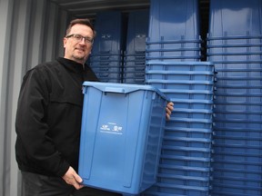 Bryan Prouse, operations manager for the City of Sarnia, stands with a truckload of blue bins at the city's public works department. Free blue bins are available for Sarnia newcomers retroactive to 2012 thanks to a donation from Nova Chemicals. (TYLER KULA, The Observer)