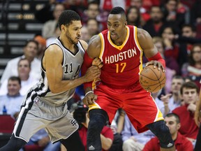 Houston Rockets center Dwight Howard (12) controls the ball during the second quarter as San Antonio Spurs forward Jeff Ayres (11) defends at Toyota Center on Nov 6, 2014 in Houston, TX, USA. (Troy Taormina/USA TODAY Sports)