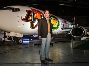 CFL Commissioner Mark Cohon poses in front of a Canadian North Boeing 737-300 at the airline's hangar at the Edmonton International Airport. (Codie Mclachlan, Edmonton Sun)