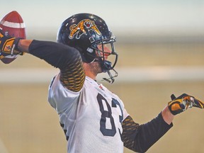 Injured receiver Andy Fantuz throws the ball during Hamilton Tiger-Cats practice on Tuesday. (DAVE ABEL/Toronto Sun)