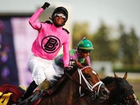 Patrick Husbands won the Queen's Plate aboard Lexie Lou on July 6, 2014. (Reuters)