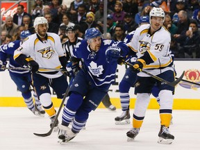 Maple Leafs forward Leo Komarov locks in on a loose puck against the Nashville Predators on Tuesday night at the ACC. (STAN BEHAL/Toronto Sun)