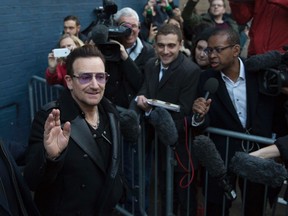 Irish band U2's lead singer, Bono, leaves the recording of the Band Aid 30 charity single in west London  November 15, 2014. (Neil Hall/Reuters)