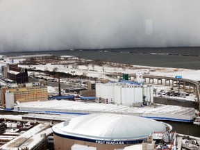 A lake-effect snowstorm with freezing temperatures produces a wall of snow travelling over Lake Erie into Buffalo, N.Y., on November 18, 2014. A whirlpool of frigid, dense air known as a "polar vortex" descended Tuesday into much of the Northeastern U.S. (REUTERS/Gary Wiepert)