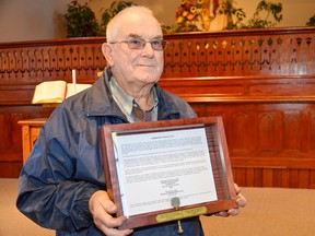 Bill Brown presented the Egmondville United Church with a communion token from 1845 he found on his property.