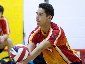 Anas Eid of the Saunders Sabres bumps the ball while playing against the Lucas Vikings at Saunders in London, Ontario on Wednesday, September 17, 2014. . DEREK RUTTAN/ The London Free Press /QMI AGENCY