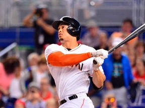 Miami Marlins right fielder Giancarlo Stanton connects for a solo home run against the Cincinnati Reds at Marlins Ballpark in Miami, in this file photo taken July 31, 2014. (REUTERS)