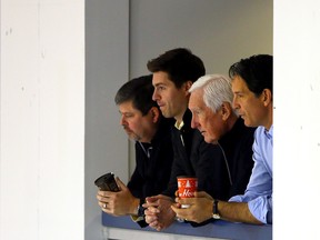 Maple Leaf management (from left) Dave Nonis, Kyle Dubas, Cliff Fletcher and Brendan Shanahan keep an eye on practice at the MasterCard Centre in Toronto on Wednesday, November 19, 2014. (Dave Abel/Toronto Sun)