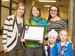 Falconer-Pounder (middle) is joined by Toni Gale and Genelle Reid, who nominated her for the honour, as well as current Bayfield Girl Guides members Guiding Sophie and Alexis Harney. Falconer-Pounder has been involved with Bayfield Girl Guides for more than 25 years and helped to spearhead a group that kept Camp Klahanie in the community. (Contributed photo)