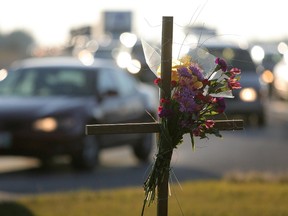 A memorial is seen at the intersection of St. Mary's Road and Bishop Grandin Boulevard in Winnipeg Monday, November 1, 2010 near where Amutha Subramanian and Senhit Mehari were killed by a driver allegedly under the influence of alcohol.