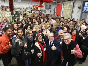 Our Rita DeMontis is surrounded by her merry band of Magical Mystery Bus contest winners.