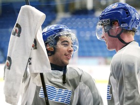 Sudbury Wolves Nick Baptiste chats with Matt Schmalz during team practice on Wednesday afternoon. The Wolves travel to North Bay today to take on the Battalion.