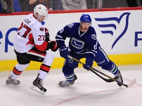 Nick Bonino battles Senators centre Curtis Lazar for the puck last week at a game in Vancouver. (USA TODAY SPORTS)