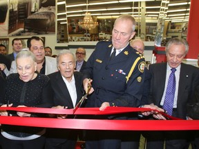 Bad Boy opening at Honest Ed's with family members along with Toronto Police Chief Bill Blair, Mel and Blayne Lastman, and Paul Godfrey Wednesday, Nov. 19, 2014. (Veronica Henri/Toronto Sun)