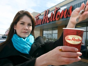 Tim Hortons will increase the price of coffee and breakfast sandwiches beginning next week. (LYLE ASPINALL/QMI Agency)