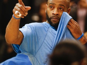 Vince Carter sheds a tear as he was honoured by the Raptors during the first quarter of the Memphis Grizzlies game Wednesday November 19, 2014. (Stan Behal/Toronto Sun)