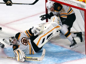 Boston Bruins defenseman Kevan Miller (86) crashes in Boston Bruins goalie Niklas Svedberg (72) net during the second period at Bell Centre on Sep 23, 2014 in Montreal, Quebec, CAN. (Jean-Yves Ahern/USA TODAY Sports)