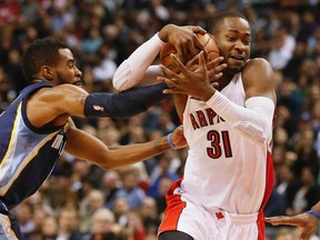 Raptors' Terrence Ross battles for the ball against the Memphis Grizzlies on Nov. 19. (Stan Behal, Toronto Sun)