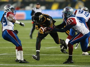 Hamilton Tiger-Cats running back Nic Grigsby in action against the Montreal Alouettes on Nov. 8. (Jack Boland, Toronto Sun)