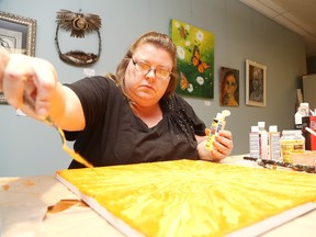 Gino Donato/The Sudbury Star
Artist Terry Fullager works on a painting at the NISA/Northern Initiative for Social Action space on Elgin Street. Fullager's work will be some of the many art pieces on display at Thursday's Downtown Sudbury Art Crawl, which goes from 5 to 8 p.m.
