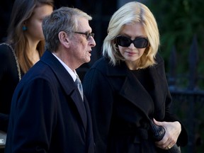 Media personality Diane Sawyer and husband Mike Nichols arrive at St. Ignatius Loyola church for fashion designer Oscar de la Renta's memorial service in the Manhattan borough of New York in this November 3, 2014 file photo.   REUTERS/Carlo Allegri