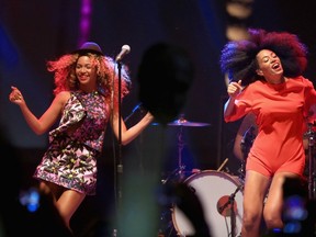 Singer Beyonce (L) performs with her sister Solange onstage during day 2 of the 2014 Coachella Valley Music & Arts Festival at the Empire Polo Club on April 12, 2014 in Indio, California.  Christopher Polk/Getty Images for Coachella/AFP