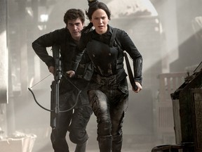 Jennifer Lawrence and Liam Hemsworth in a scene from 'The Hunger Games: Mockingjay - Part I." (Supplied photo)