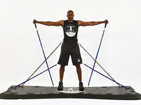 U.S. Olympic high jump gold medallist Charles Austin created the Total Body Board, a weighted platform that can be hooked up to as many as 16 exercise bands, measures 10 feet long, three inches tall and close to four feet wide. (Supplied)