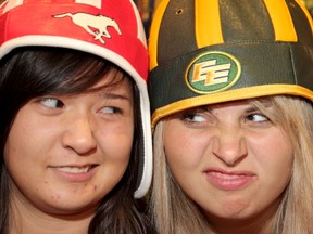 Stamps fan Samantha Phan, left, and Edmonton Eskimos fan April Battenfelder are ready for Sunday's game. QMI Agency