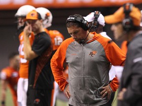 The Lions fired head coach Mike Benevides (centre) on Thursday following three seasons with the team. (Carmine Marinelli/QMI Agency)