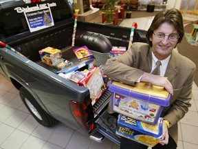 Birchwood Automotive Group's Stephen Chipman collects food and presents for the Christmas Cheer Board in this Winnipeg Sun file photo.