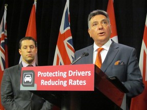 Ontario Finance Minister Charles Sousa and Government and Consumer Services Minister David Orazietti (right) at Queen's Park on Thursday, Nov. 20, 2014. (Antonella ArtusoToro​nto Sun)​