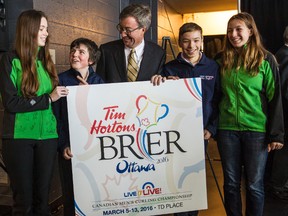 Junior curlers (L-R) Jessica Thorne, Tom Hamilton, Lucas Bourguignon and Cloe Bourguignon share a laugh with Ottawa Mayor Jim Watson following a news conference where it was announced that the city will be hosting the 2016 Canadian Men's Curling Championship, the Brier. November 20, 2014. Errol McGihon/Ottawa Sun/QMI Agency