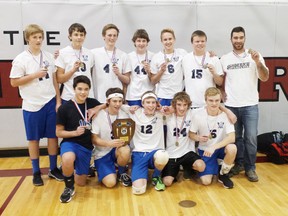 The GDCI junior boys volleyball squad shows off their gold medals after earning the top spot at WOSSA A Championship on Nov. 13.