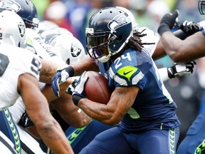 Seattle Seahawks running back Marshawn Lynch (24) rushes against the Oakland Raiders during the first quarter at CenturyLink Field on Nov 2, 2014 in Seattle, WA, USA. (Joe Nicholson/USA TODAY Sports)