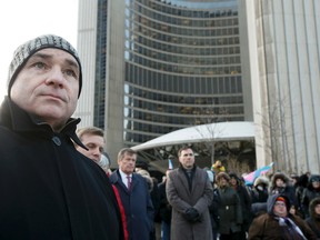 George Smitherman and Mayor-elect John Tory City Hall’s first flag raising for the Transgender Day of Remembrance Thursday November 20, 2014. (Stan Behal/Toronto Sun)