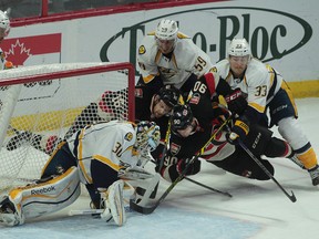 The Ottawa Senators took on the Nashville Predators at Canadian Tire Centre in Ottawa Thursday Nov 20,  2014.  Ottawa Senators Alec Chiasson and Clarke MacArthur battles with Carter Hutton from the Nashville Predators during first period action Thursday. Tony Caldwell/Ottawa Sun/QMI Agency