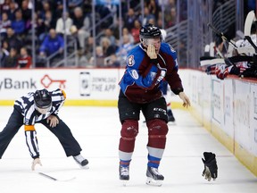 Colorado Avalanche left wing Alex Tanguay (40) exits the ice after being injured during the second period against the Washington Capitals at Pepsi Center on Nov 20, 2014 in Denver, CO, USA. (Chris Humphreys/USA TODAY Sports)