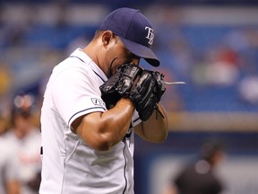 Tampa Bay Rays relief pitcher Joel Peralta (62) reacts as he walks back to the dugout at the end of the eighth inning against the Detroit Tigers at Tropicana Field. (Kim Klement/USA TODAY Sports)
