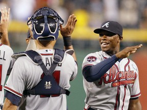 Atlanta Braves catcher Gerald Laird and left fielder Justin Upton (right) celebrate after defeating the Pittsburgh Pirates 7-3 at PNC Park. (Charles LeClaire/USA TODAY Sports)