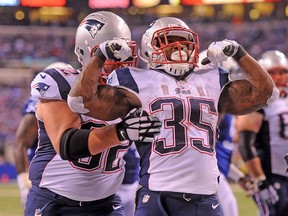 New England Patriots running back Jonas Gray (35) celebrates one of his four touchdowns against the Indianapolis Colts Sunday, November 16, 2014 at Lucas Oil Stadium. (Thomas J. Russo/USA TODAY Sports)