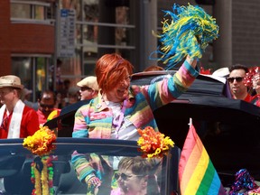 MLA Laurie Blakeman wave to the crowd during the Pride Parade in downtown Edmonton, Alta., on Saturday, June 7, 2014.  Perry Mah/Edmonton Sun/QMI Agency