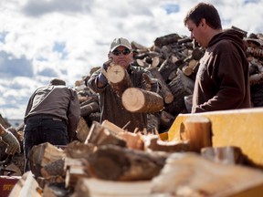 Pictured, mmembers of the Trailblazers chop wood in Oct. 2014, to help prepare Whitecourt's snowmobile trails for winter. Now they're in the final stages and need volunteers who may have ATV's to help clear the remaining 300km of trails.

Adam Dietrich file photo | Whitecourt Star