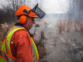 Glen Renfert observes the water flow after a beaver dam was destroyed in Woodlands County.

Christopher King | Whitecourt Star