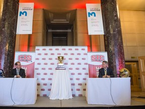 Bisons coach Brian Dobie (right) and Montreal's Danny Maciocia held a press conference Friday in Montreal, where they will play Saturday for the right to get to the Vanier Cup.