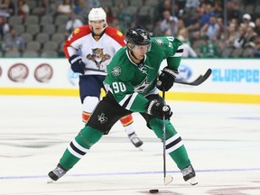 DALLAS, TX - SEPTEMBER 29: Jason Spezza #90 of the Dallas Stars skates the puck against the Florida Panthers during a preseason game at American Airlines Center on September 29, 2014 in Dallas, Texas.   Ronald Martinez/Getty Images/AFP== FOR NEWSPAPERS, INTERNET, TELCOS & TELEVISION USE ONLY ==