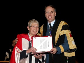 Honorary degree recipient Elizabeth Jane Errington receives her degree from Commandant Brig.-Gen Al Meinzinger at the 101st Convocation at the Royal Military College in Kingston on Friday November 21 2014. Meinzinger is also a former student of Errington. (IANMACALPINE)-KINGSTON WHIG-STANDARD/QMI AGENCY